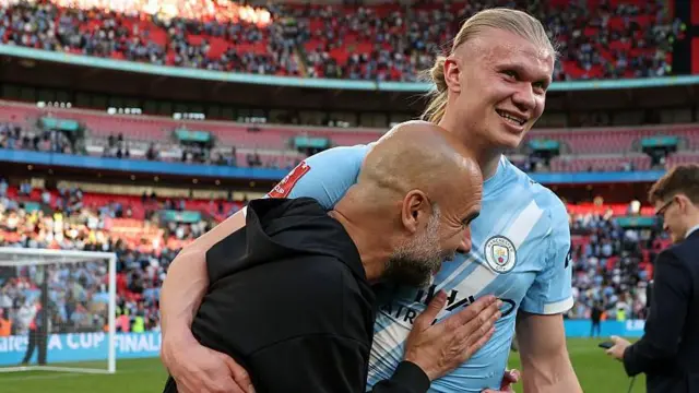 Pep Guardiola, Manager of Manchester City, celebrates with Erling Haaland following the team's victory