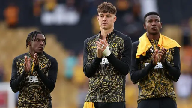 Jean-Ricner Bellegarde and Jorgen Strand Larsen of Wolverhampton Wanderers applaud the fans at the end of the Premier League match between Wolverhampton Wanderers and Manchester City at Molineux
