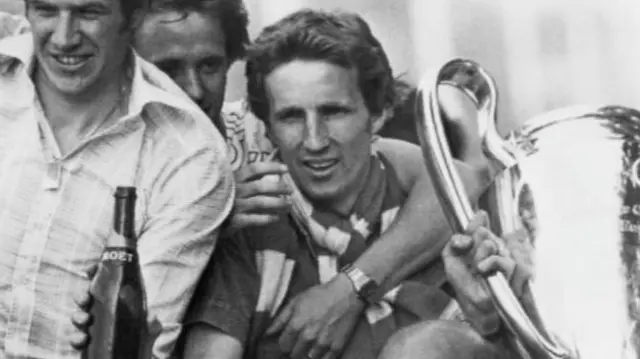 Joey Jones, holding the European Cup, pictured with Emlyn Hughes and Phil Neal during Liverpool's victory parade in 1977