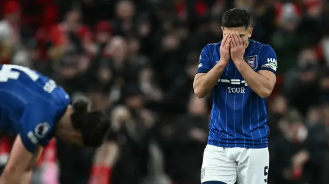 Sam Morsy with his head in his hands