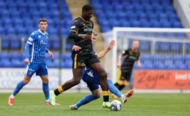 Livingston's Joel Nouble and St Johnstone's Sven Sprangler in action