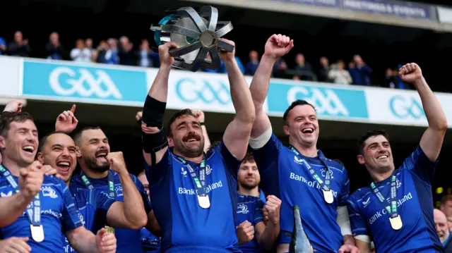 Jack Conan lifts the URC trophy
