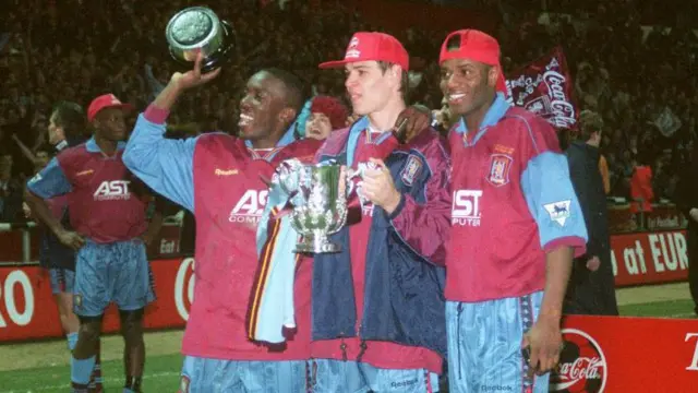 Dwight Yorke, Savo Milosevic and Ian Taylor celebrate winning the League Cup