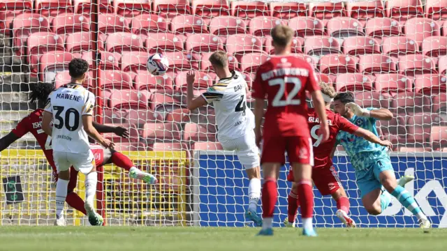 Swindon Town striker Paul Glatzel scores