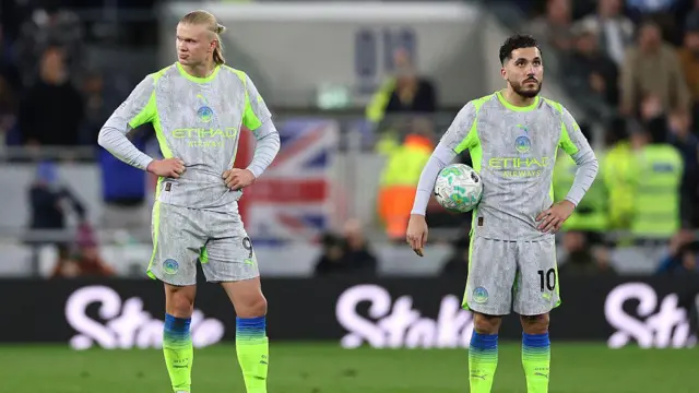 Erling Haaland and Rayan Cherki react at full-time