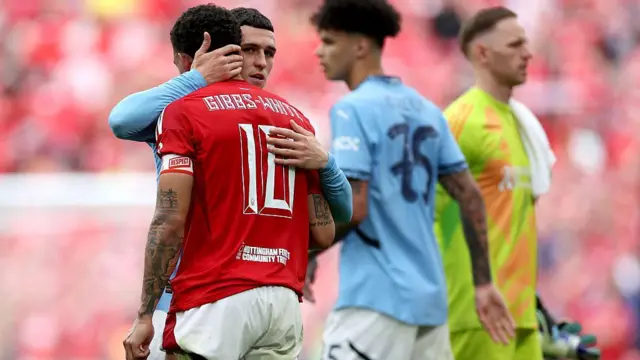 Phil Foden and Morgan Gibbs-White embrace after the FA Cup semi-final 