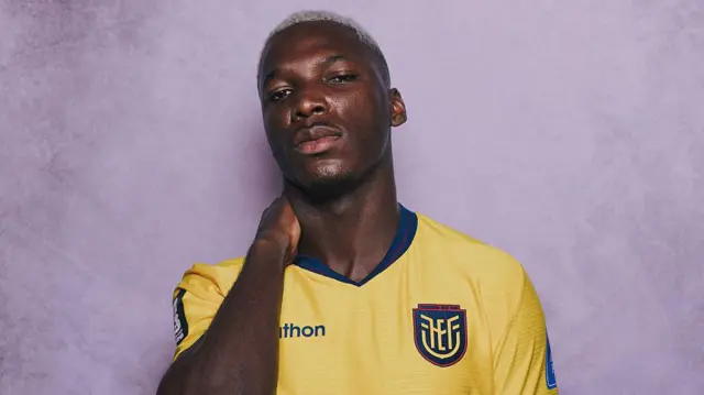 Moises Caicedo posing with his hand behind his neck for a Fifa photoshoot with Ecuador