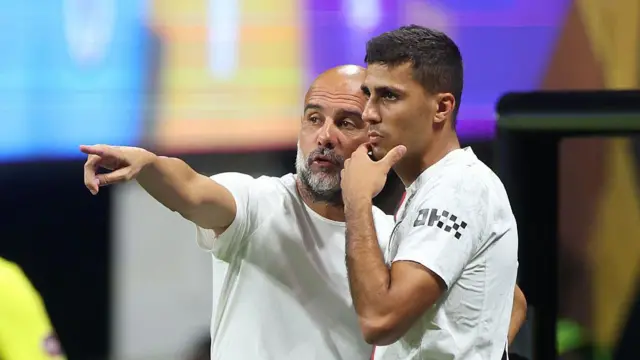 Pep Guardiola and Rodri