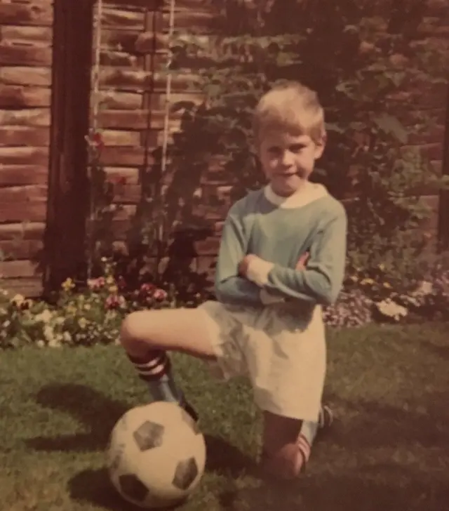 Young Man City fan posing in a City kit.