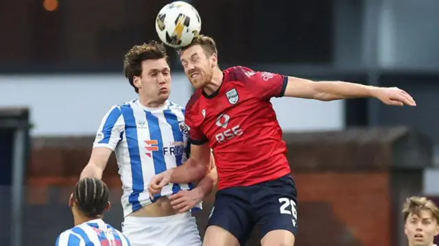 Ross County's Jordan White (R) and Kilmarnock's Joe Wright (L) in action during a William Hill Premiership match between Kilmarnock and Ross County at The BBSP Stadium Rugby Park