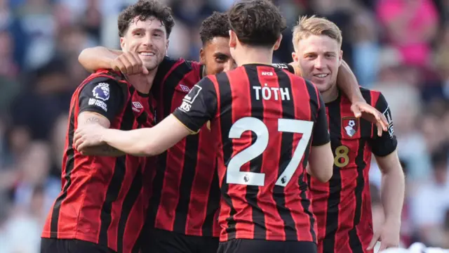 Bournemouth players celebrate the win at Fulham
