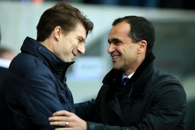 A smiling Roberto Martinez greets Michael Laudrup 