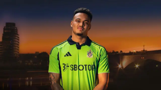 Fulham striker Rodrigo Muniz models the club's new green 2025-26 away kit
