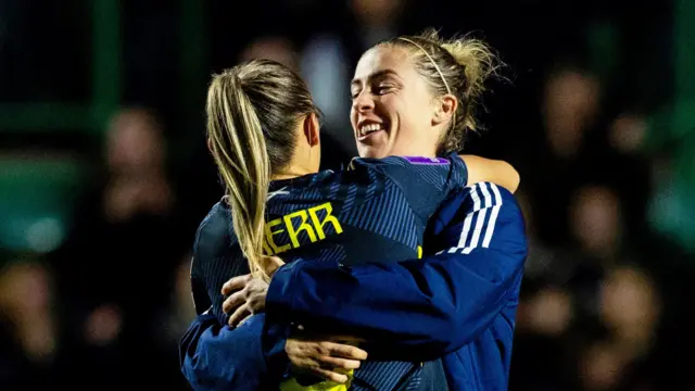 Nicola Docherty hugs Sam Kerr after Scotland's win against Hungary at Easter Road