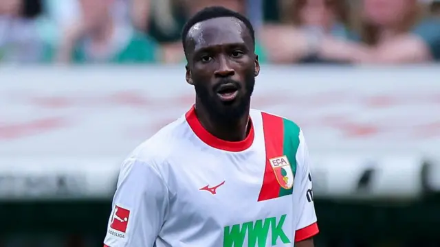 Chrislain Matsima looking tired while playing for Augsburg