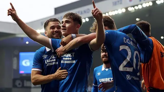 Findlay Curtis of Rangers celebrates with teammates after scoring his team's first goal during the UEFA Champions League Second Qualifying Round First Leg match between Rangers and Panathinaikos 