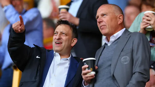 Tony Bloom and Paul Barber in discussions in the stands during Brighton match