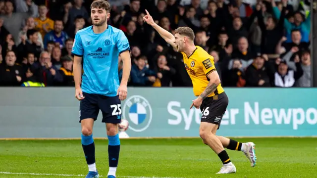 Cameron Evans celebrates his goal against Crewe