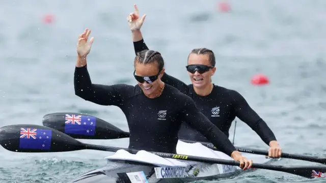 Lisa Carrington and Alicia Hoskin celebrate winning gold in the women's kayak double 500m at the Paris Olympics