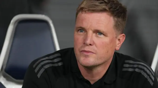 Eddie Howe sits in the dugout