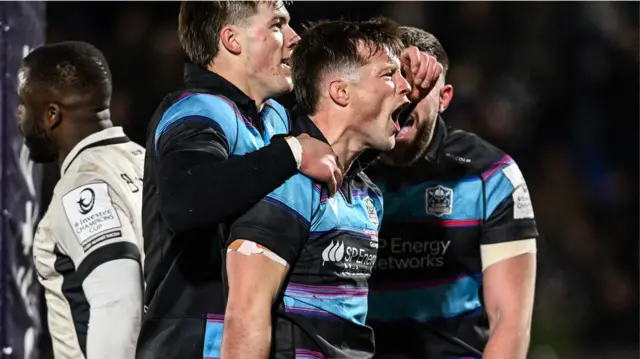 George Horne celebrates with teammate Huw Jones after scoring for Glasgow Warriors