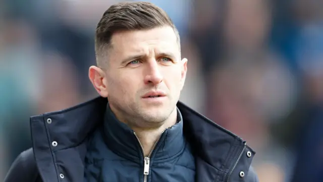 Portsmouth manager John Mousinho looks disappointed during the 2-1 defeat at Preston North End