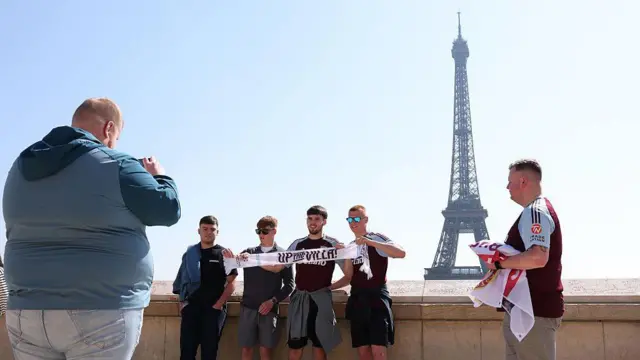 Aston Villa fans stand by the Eiffel Tower