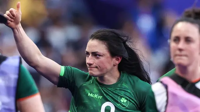 Lucy Mulhall Rock waves to Ireland fans after the team's quarter-finals defeat in the Olympic Sevens in Paris