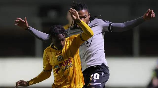 EFL Trophy November 2023 - Matty Bondswell of Newport County holds off Jevani Brown of Bristol Rovers 