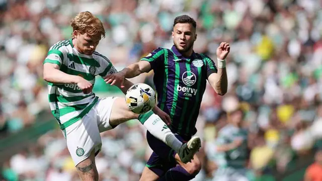 Mykola Kuharevich challenges a Celtic player for the ball in a game for Hibernian