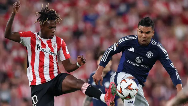 Nico Williams and Casemiro challenge for the ball