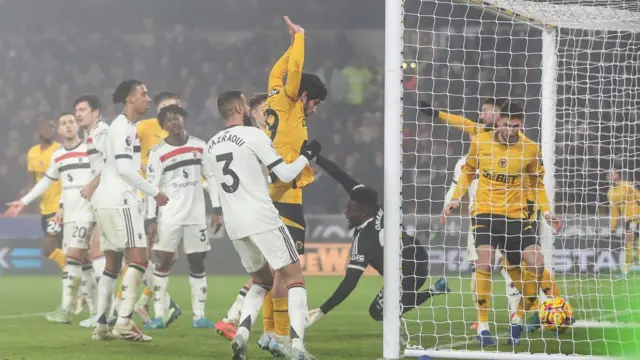 Matheus Cunha beats goalkeeper Andre Onana to score