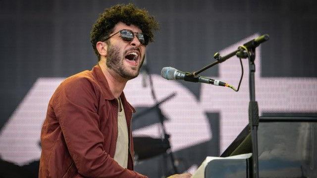 Billy Lockett singing and playing the piano