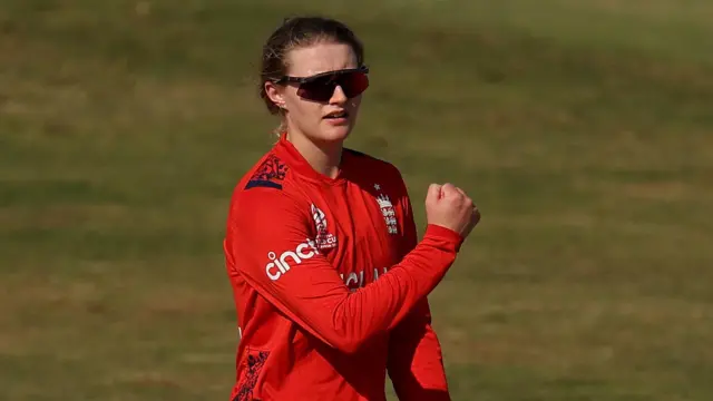 Charlie Dean celebrates taking a wicket