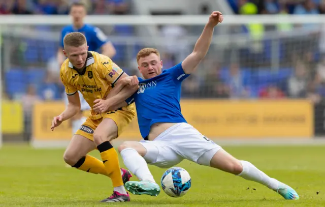 Livingston's Stephen Kelly (L) and St Johnstone's James Brown