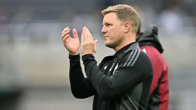 Eddie Howe applauds supporters on the pitch after the Premier League football match between Newcastle United and Tottenham Hotspur 