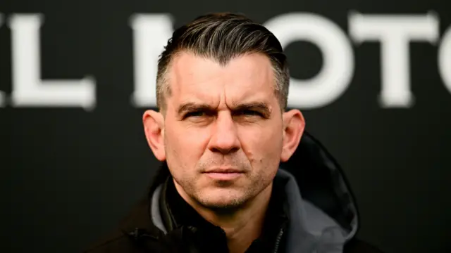 Oxford United boss Matt Bloomfield looks on from the sidelines