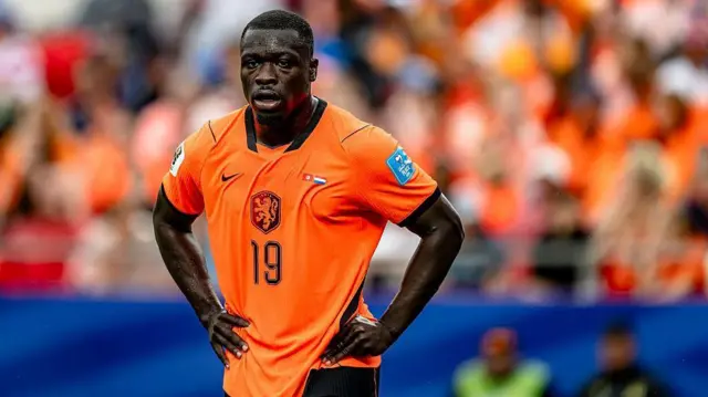Brian Brobbey of the Netherlands looks on