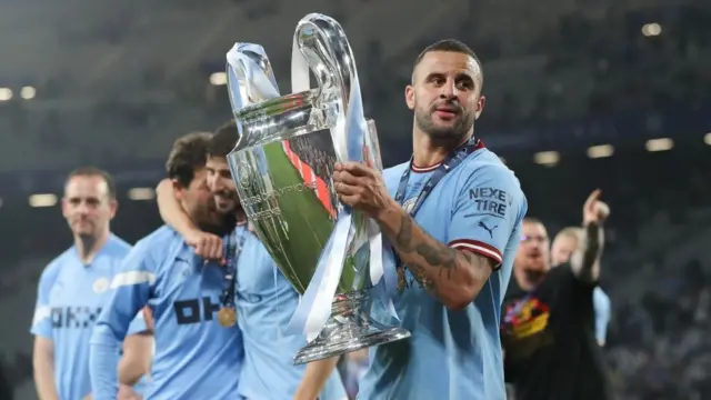 Kyle Walker lifts the Champions League trophy