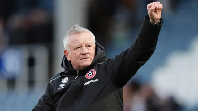 Chris Wilder salutes the Sheffield United fans after the win at QPR