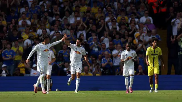 Joel Piroe celebrates scoring his team's first goal with teammate Ilia Gruev during the pre-season friendly match between Leeds United and Villarrea