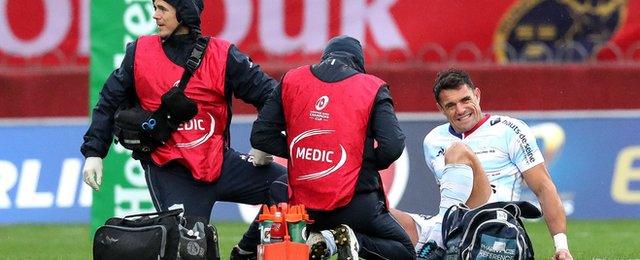 New Zealand's World Cup-winning fly-half Dan Carter had a quiet game after picking up a leg injury in the second minute