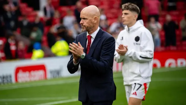 Erik ten Hag, Manager of Manchester United applauds the fans after defeat to Liverpool