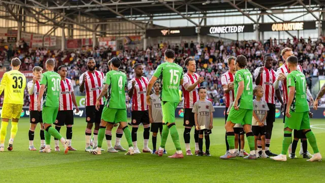 Brentford and Borussia Monchengladbach players shake hands ahead of the pre-season friendly