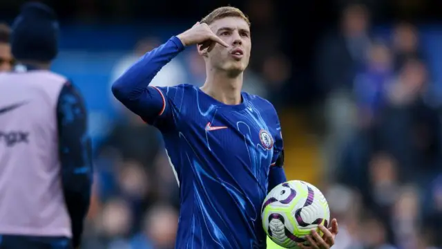 Cole Palmer of Chelsea with the match-ball after he scores all four of his sides goals in their 4-2 victory during the Premier League match between Chelsea FC and Brighton & Hove Albion FC at Stamford Bridge