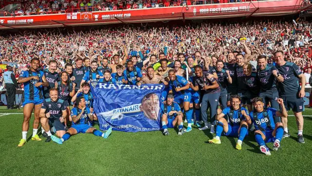 Bournemouth players celebrate after their side's 1-1 draw, a sixth-place finish and Europa League place.