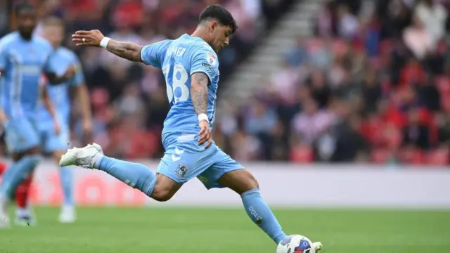 Coventry player Gustavo Hamer goes to kick a ball