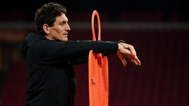 Keith Andrews leans on a training prop