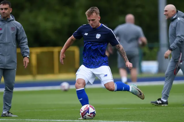 Isaak Davies warming up before Cardiff City's pre-season game against Kidderminster Harriers