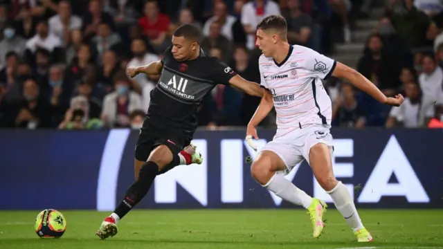 Maxime Esteve battles with Kylian Mbappe